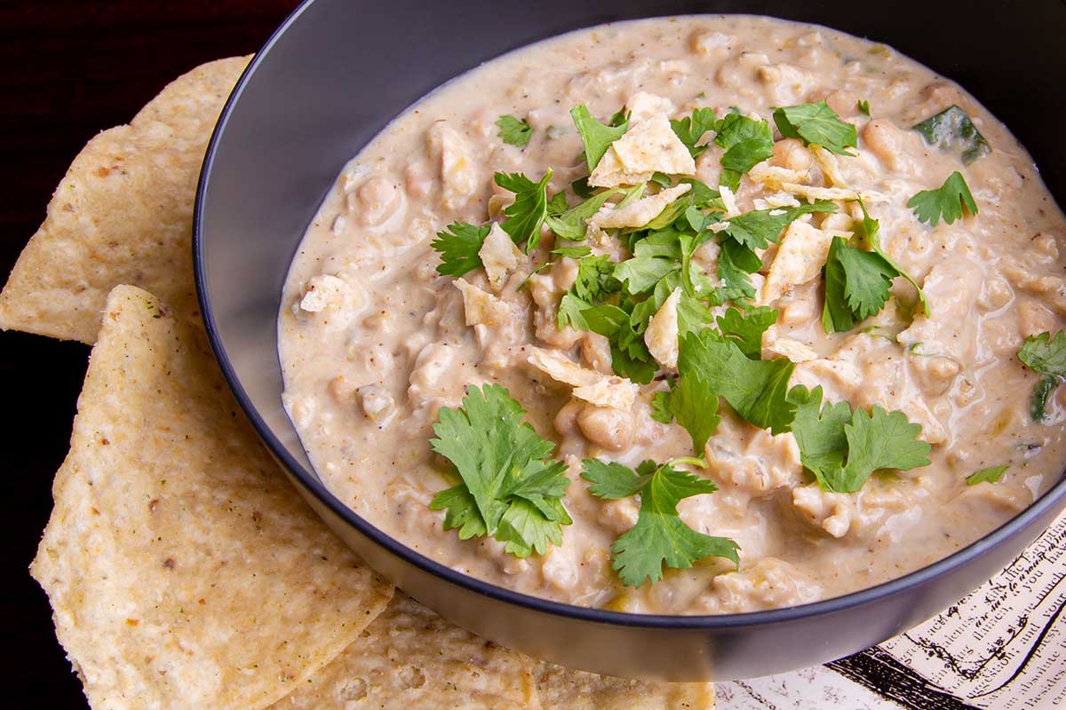 White chicken chili served with tortilla chips